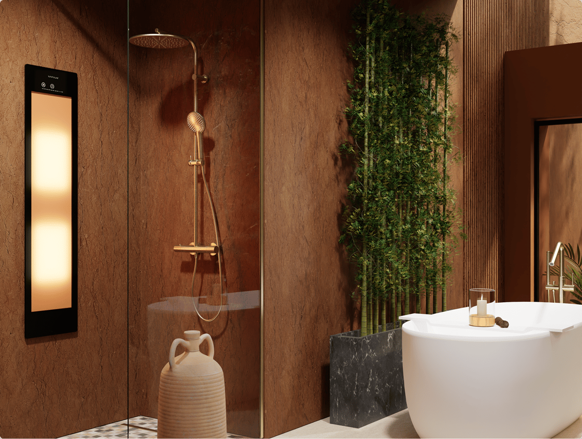 Une salle de bains apaisante japandi de X²O salles de bains avec une douche dorée, baignoire îlot, bambous et éléments naturels, murs bruns chaleureux et panneau lumineux d’ambiance.
