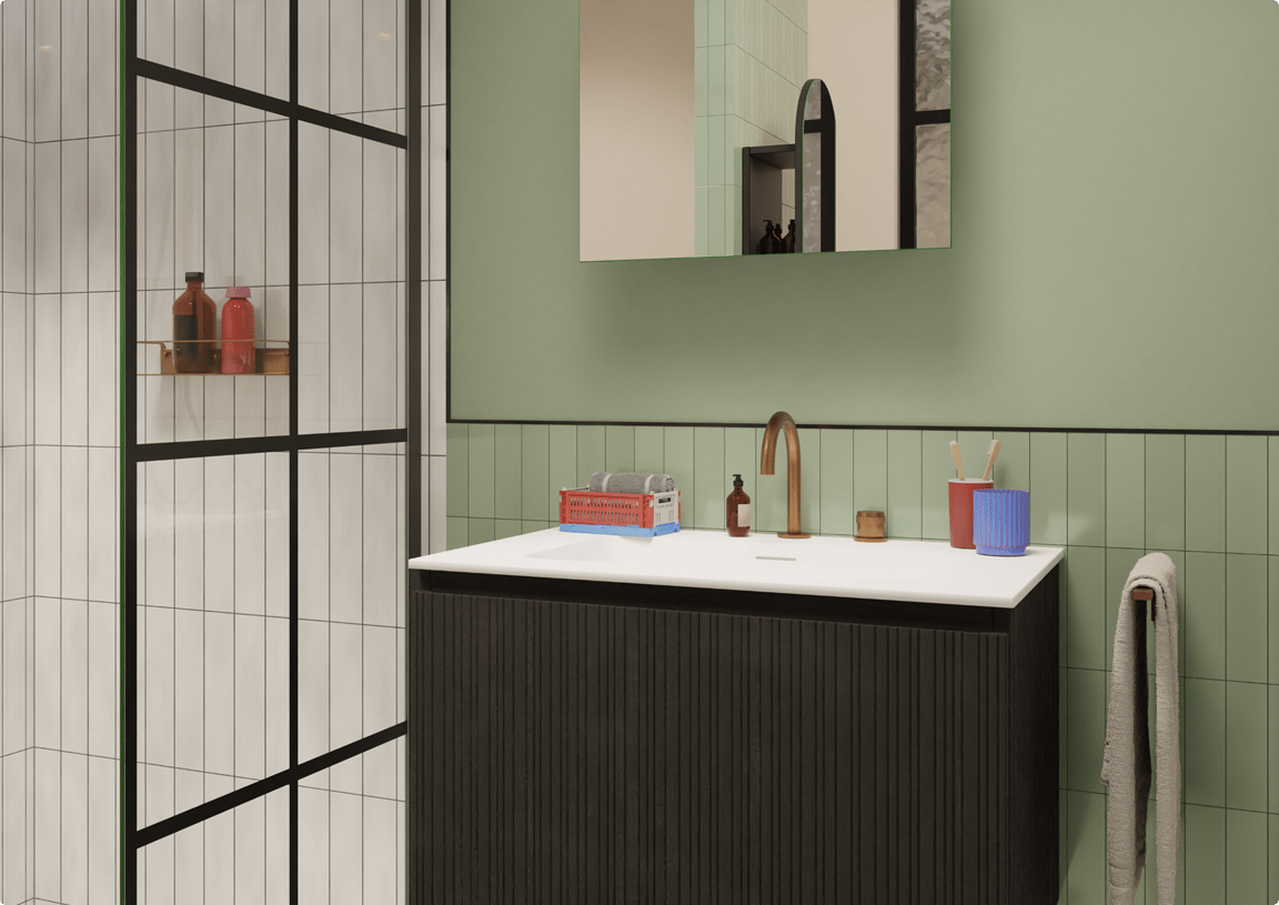 Salle de bains avec carrelage mural vert et meuble noir avec robinet doré, dans l’esprit des couleurs tendance salle de bains 2026. À découvrir chez X²O Salle de bains.