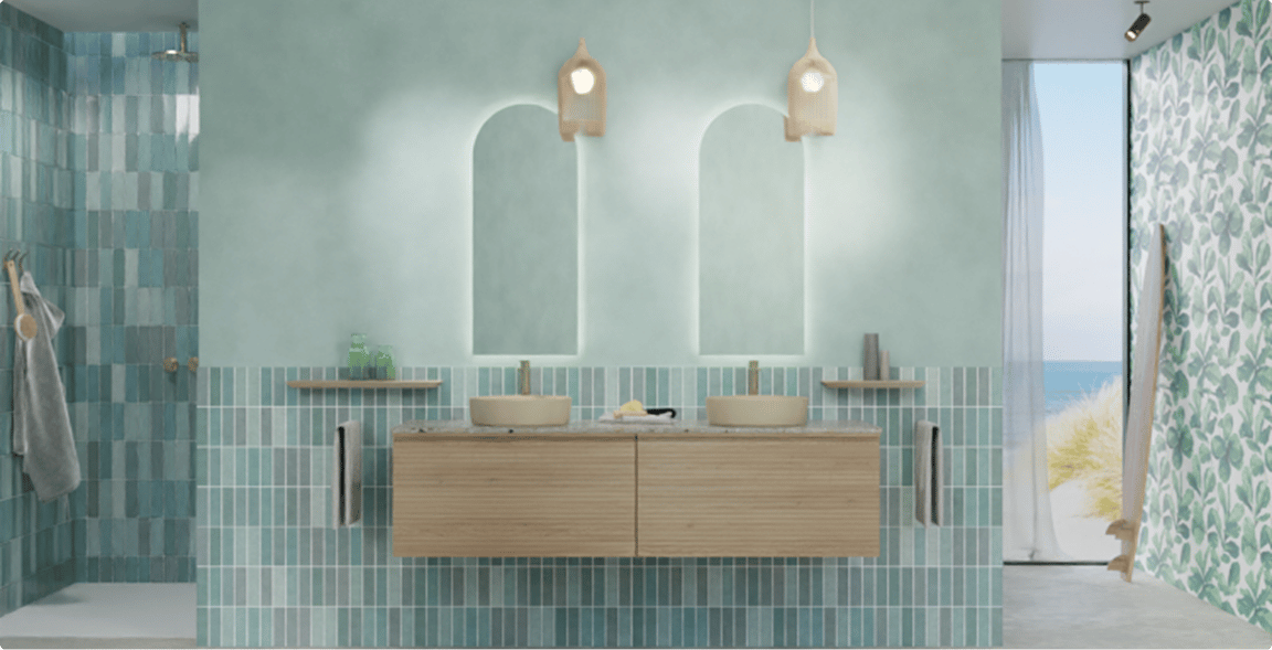 Salle de bains fraîche avec carrelage mural bleu et meuble en bois suspendu avec vasques beiges. Une belle interprétation des couleurs tendance 2026 de X²O Salle de bains.