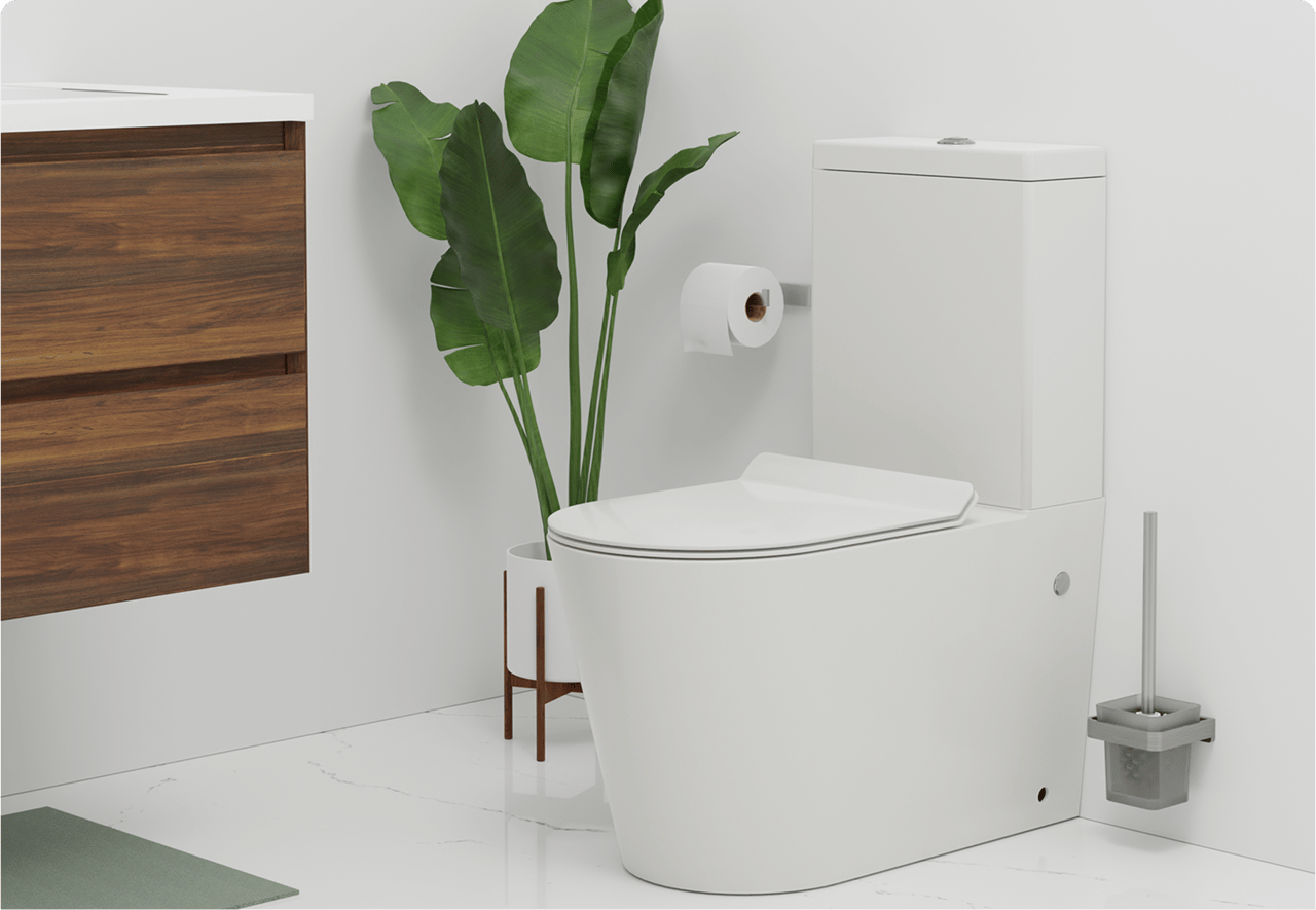 Une toilette sur pied blanche dans un décor minimaliste avec plante verte, brosse WC et meuble en bois. Atmosphère naturelle de x²o badkamers.
