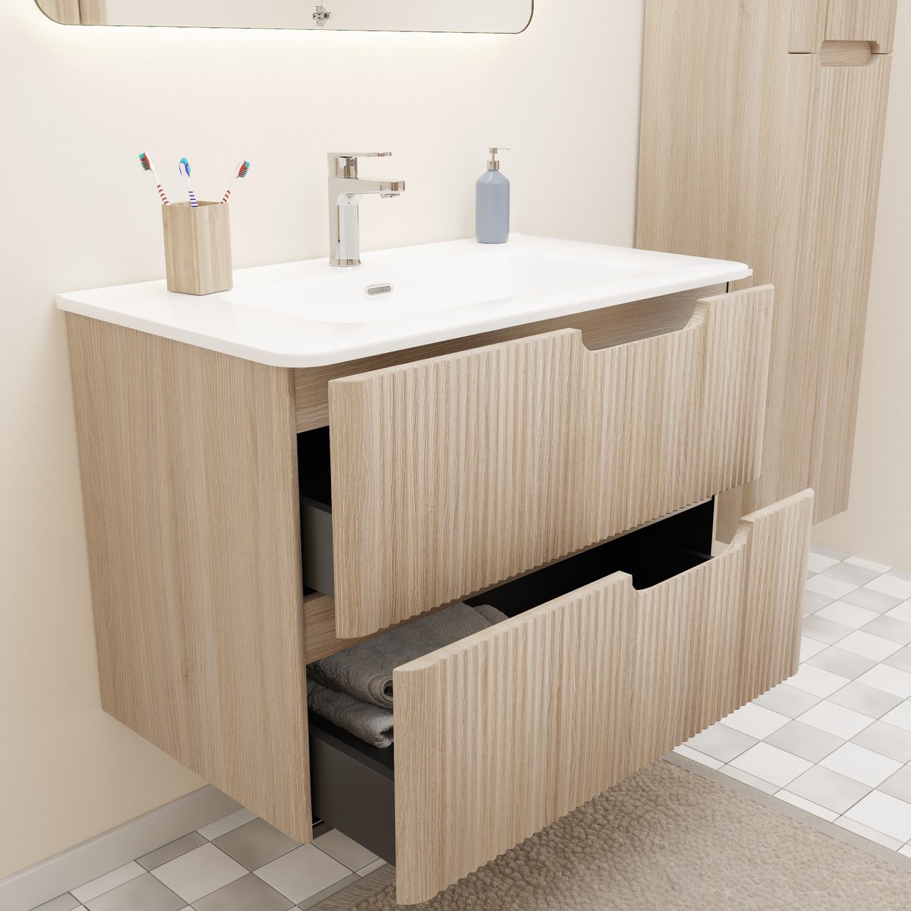 Modern houten wastafelmeubel met witte wastafel, geribbelde fronten, geopende lades, handdoeken en bijpassende hoge kast.