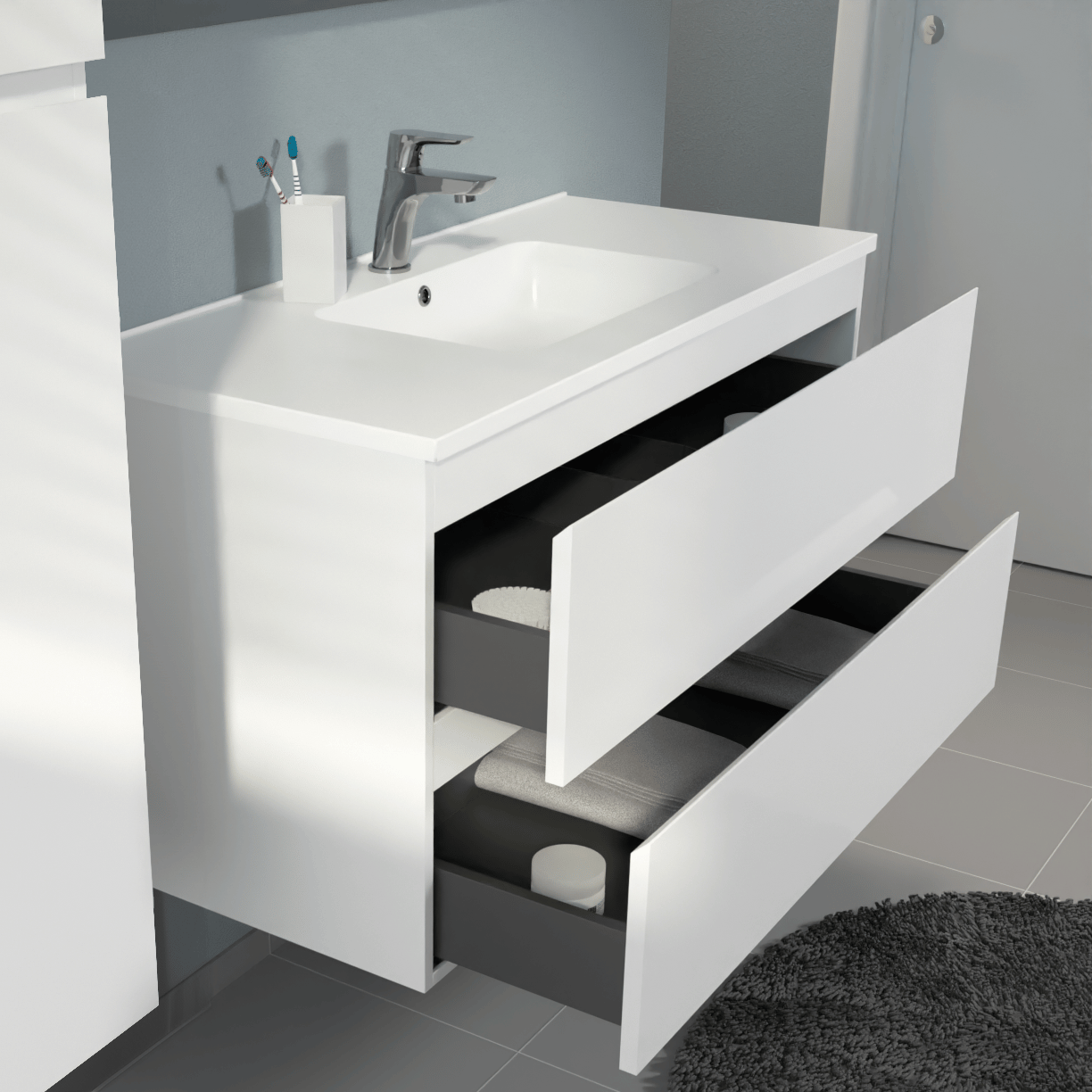 Modern wit wastafelmeubel met geïntegreerde wastafel, chromen kraan, geopende lades en opbergruimte voor handdoeken.