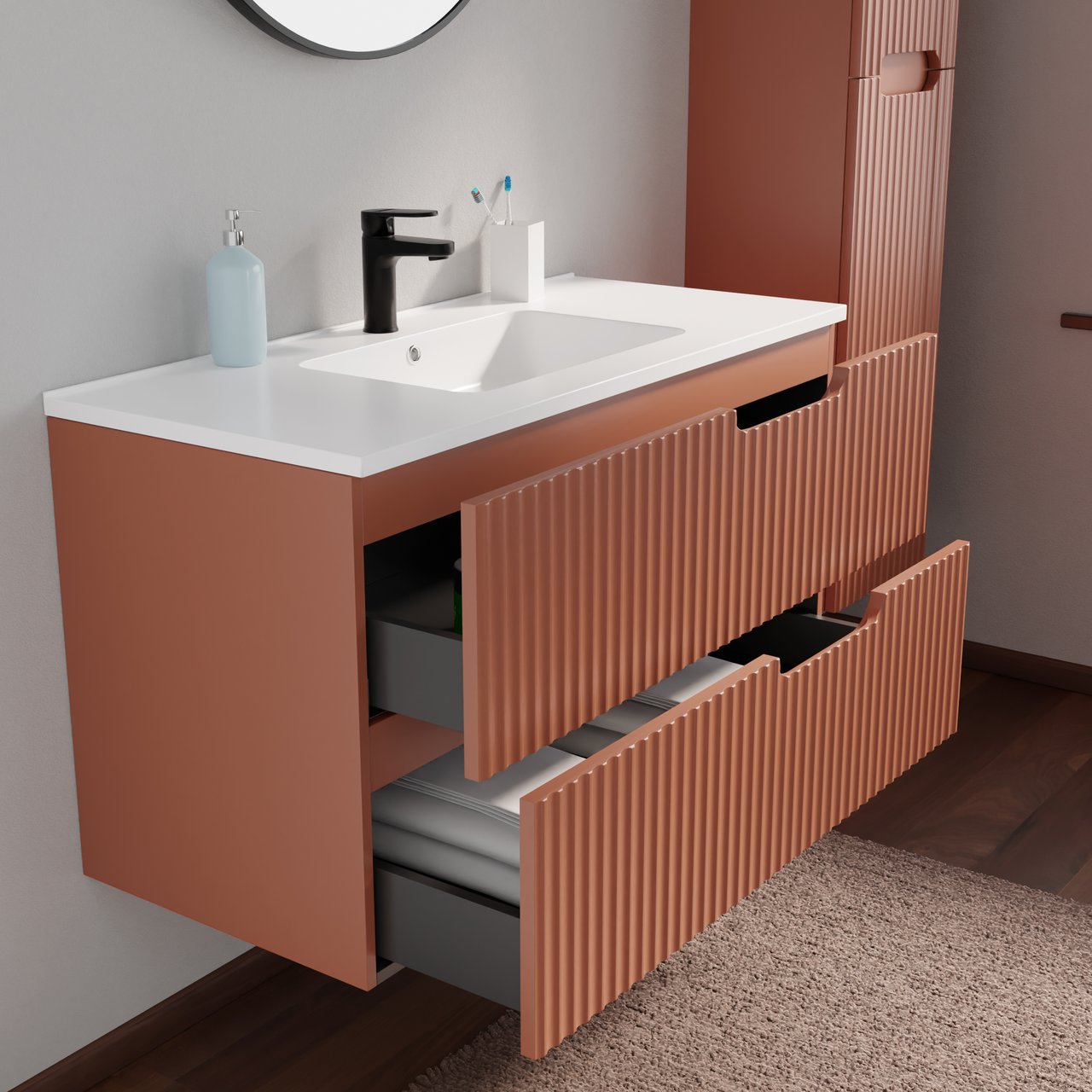 Modern terracotta wastafelmeubel met witte wastafel, zwarte kraan, geribbelde fronten, geopende lades en bijpassende hoge kast.