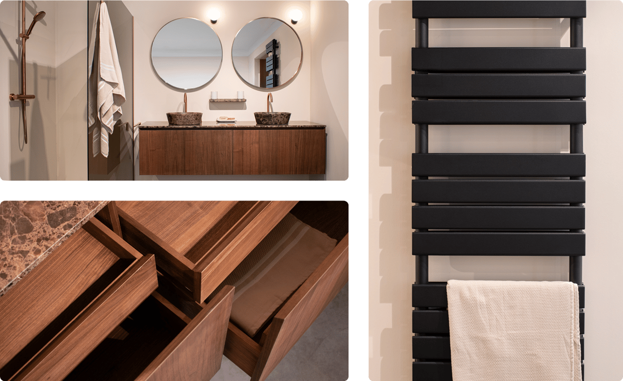 Zwarte handdoekradiator met opgehangen lichte handdoek. Detail van open schuifladen in een houten badkamermeubel.