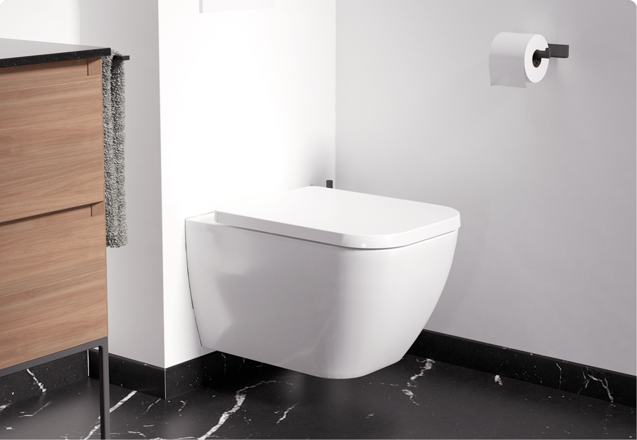 Een wit hangtoilet met strakke lijnen, naast een houten kastje op een zwarte marmeren vloer. Een moderne stijl van x²o badkamers.