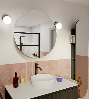 Miroir rond au-dessus d’un lavabo moderne avec carreaux roses et accessoires minimalistes.	