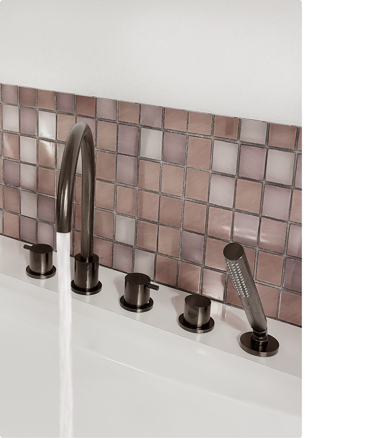 Op deze foto van x²o badkamers zie je een op de badrand gemonteerde badkraan in bronskleur, met een hoge gebogen uitloop waar water uit stroomt, vier ronde bedieningsknoppen op een rij en een cilindrische handdouche, alles geplaatst voor een wand met glanzende vierkante tegeltjes in roze en paarse tinten.