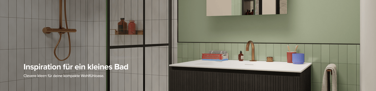 Eine moderne begehbare Dusche mit schwarzen Profilen und weißen Fliesen neben einem eleganten schwarzen Waschbeckenmöbel. Die grüne Wandfliese und die kupferfarbene Armatur setzen spannende Akzente – typisch für durchdachte x²o Badezimmer auf kleinem Raum.