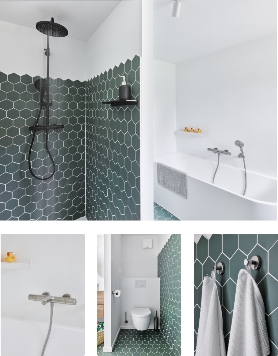 Modernes Badezimmer mit Holzschrank und grünen sechseckigen Fliesen.