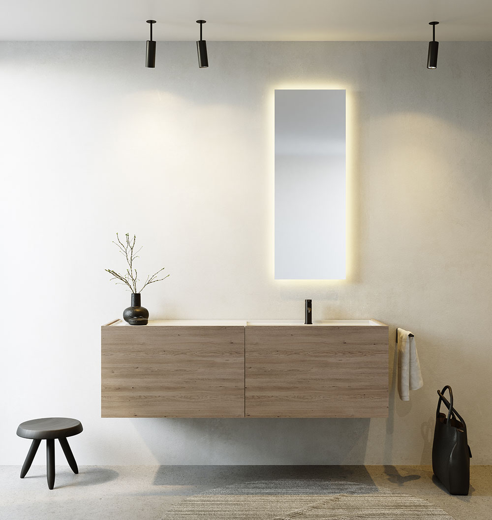 Minimalistische badkamer met houten wastafelmeubel, verlichte spiegel en eenvoudige inrichting.