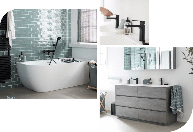 Badezimmer mit freistehender Badewanne, Betonmöbel, schwarzen Armaturen und grünen Wandfliesen.