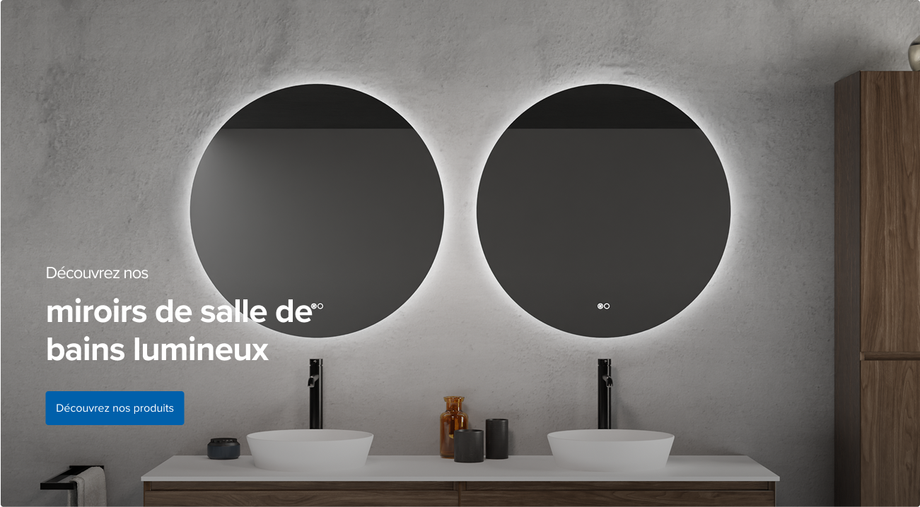 Deux miroirs de salle de bains ronds avec éclairage intégré au-dessus de deux vasques et d’un meuble bas en bois – inspiration design de x²o salles de bains.