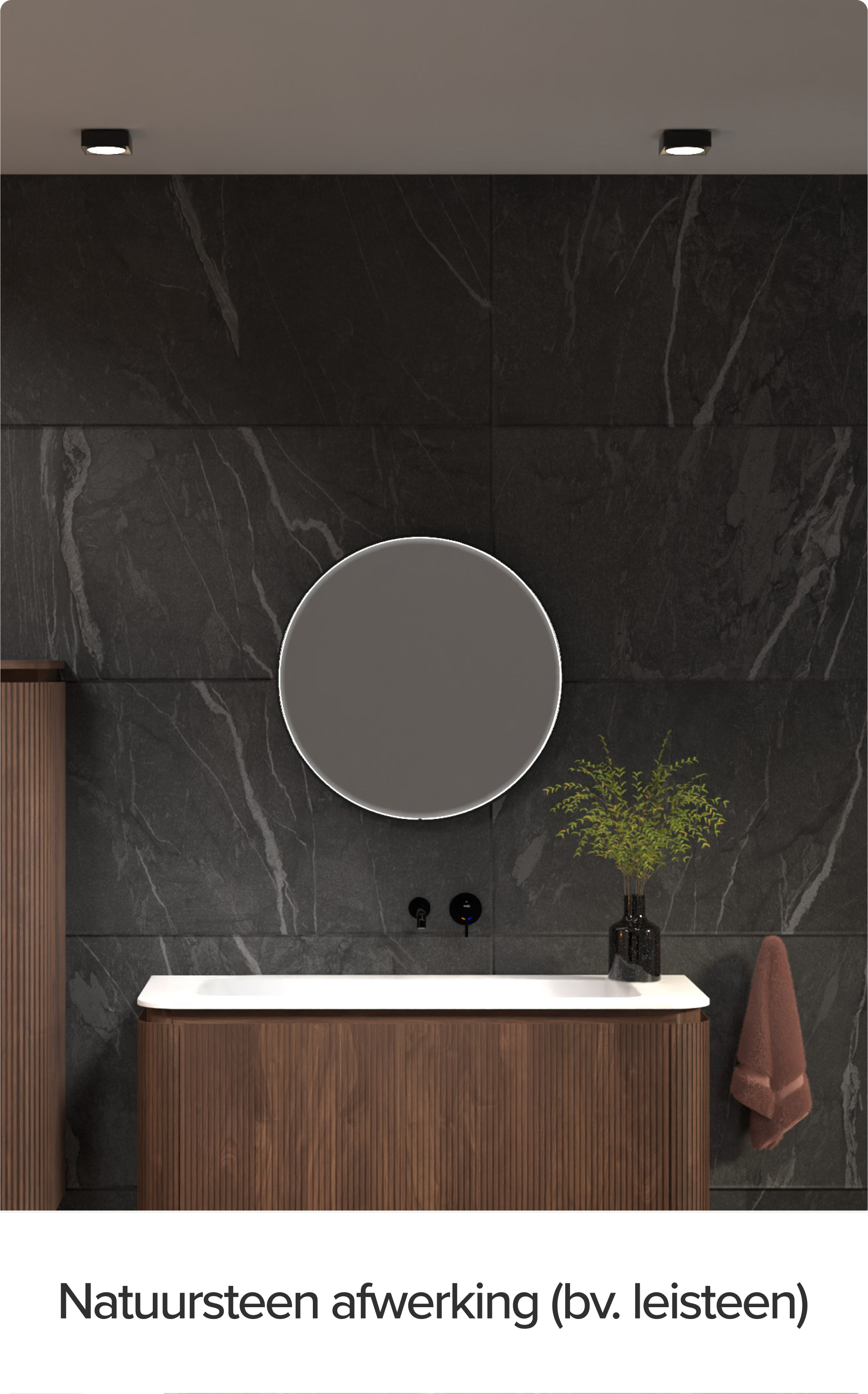 x²o badkamers meubel tegen een wand met natuursteenafwerking in leisteen-look. Rond verlicht spiegel, verticale houten kolomkasten en een zwart kraantje boven een wit werkblad benadrukken het luxe karakter.