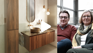 Video-thumbnail van een badkamermeubel in warm hout met afgeronde spiegel, zachte verlichting en een afspeelicoon in het midden van de afbeelding.