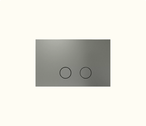 Une plaque de déclenchement rectangulaire en inox avec deux boutons ronds, solution discrète de chasse d’eau par x²o badkamers.