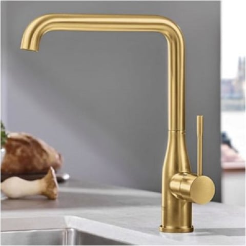Gouden keukenkraan met een strak, modern ontwerp en een handgreep aan de zijkant.