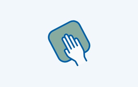 Icon mit einer Hand und einem Tuch, das die einfache Reinigung und Pflege von Melamin-Badmöbeln bei x²o Badezimmer zeigt.