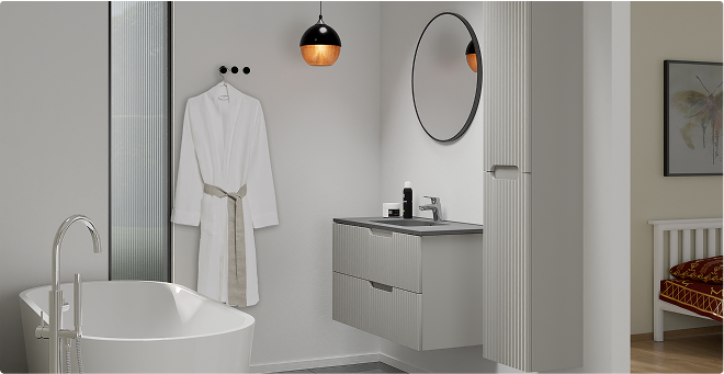 Salle de bains attenante avec baignoire îlot et meuble compact dans la chambre – X²O Salles de Bains