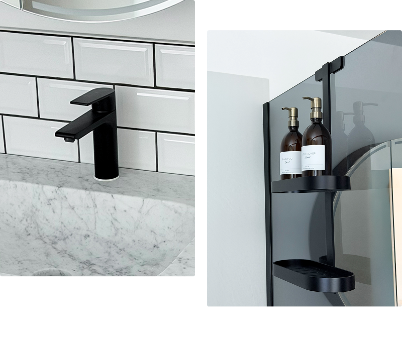 Detail van een mat zwarte wastafelkraan van x²o badkamers op een marmeren wastafelblad met witte tegelwand.