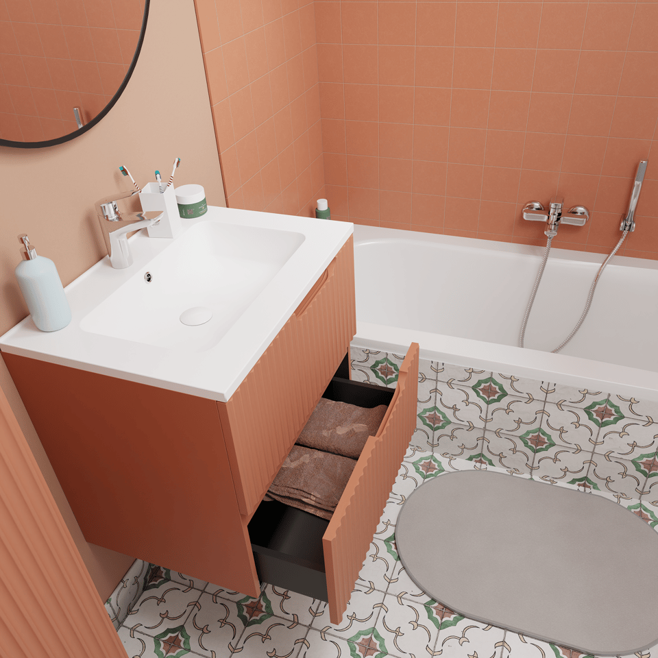 Modernes Badezimmer mit Waschtisch in terracottafarbener Optik mit geöffneter Schublade mit Handtüchern, integriertem Waschbecken, rundem Spiegel, Badewanne mit Wandarmatur und dekorativ gemustertem Boden x²o Badezimmer