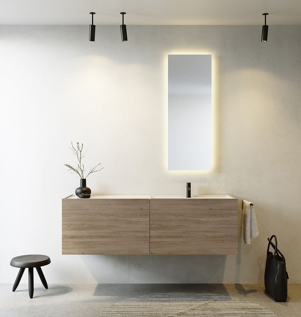 Salle de bain minimaliste avec meuble lavabo en bois, miroir lumineux et décoration épurée.
